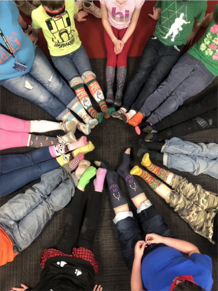 Students with their crazy socks in a circle