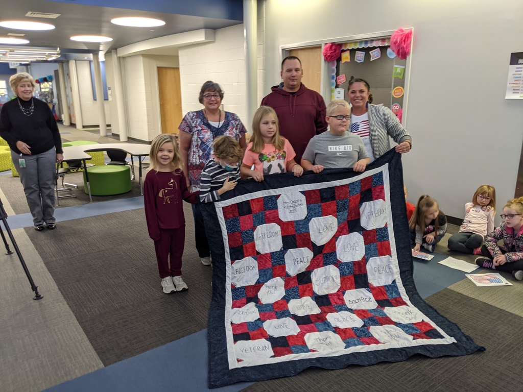 Mr. Hinton being presented with a quilt