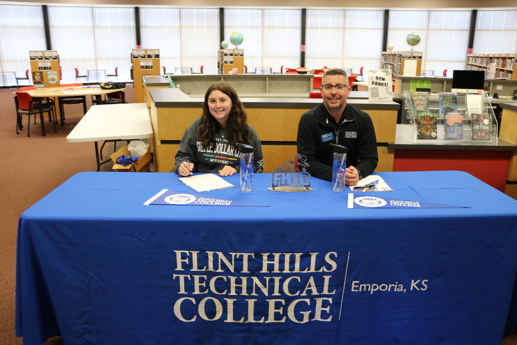 Student signing with Flint Hills Technical College